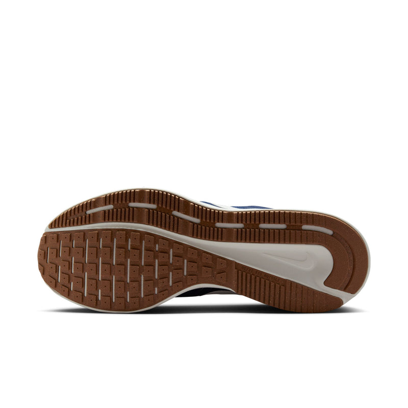 Men's running shoe outsole, brown traction tread with white heel stripe
