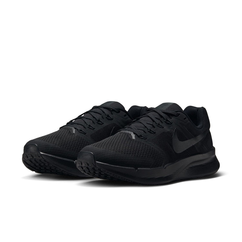 Pair of black running shoes from side angle with textured knit upper