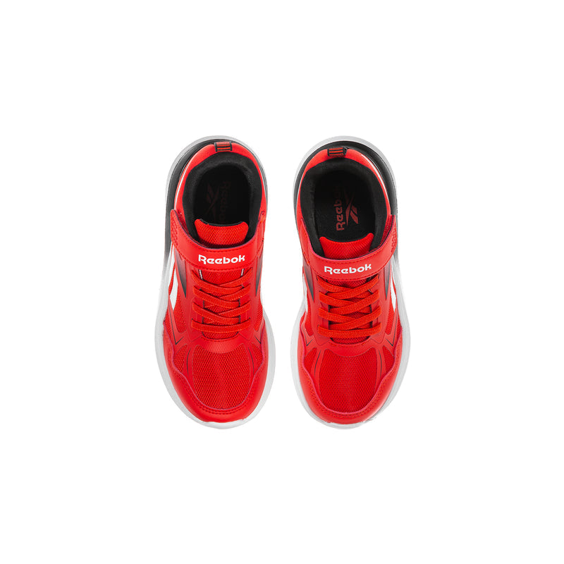 Kids red sneakers front view with white midsole and Reebok logo on inside tongue