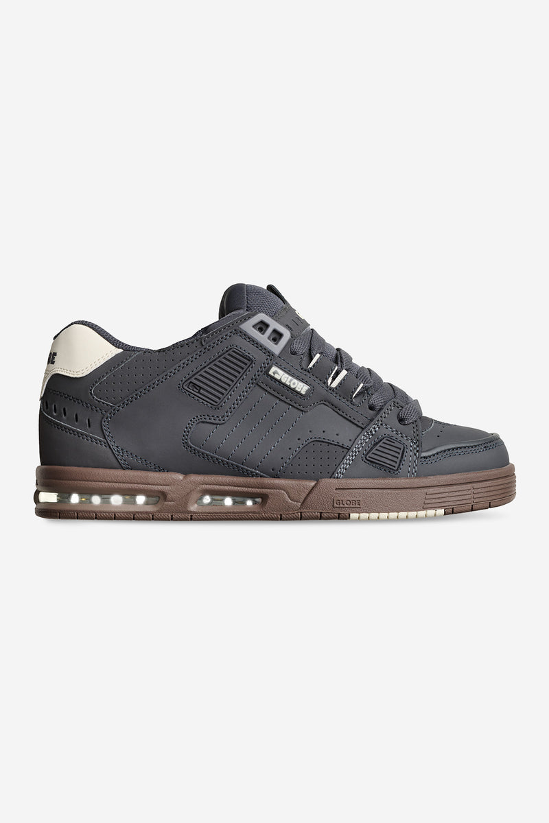Side view of Sabre Lead Gum sneaker with dark grey upper and tan gum sole