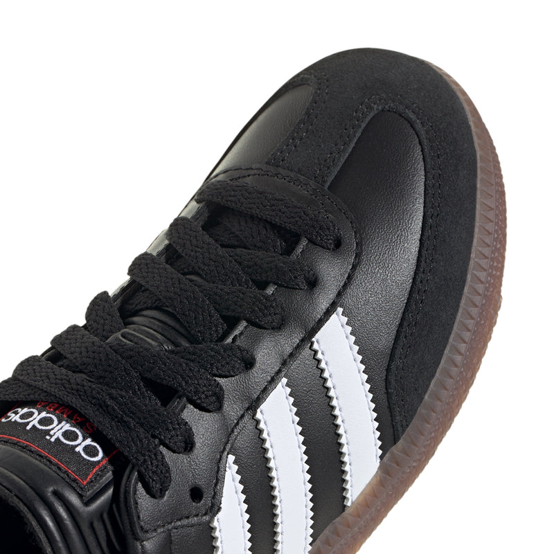 Close-up of kids' black Samba Classic sneaker laces and smooth leather with white stripes