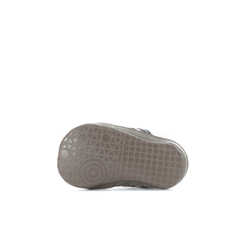 Infant adidas Samba sneaker outsole with textured rubber tread pattern