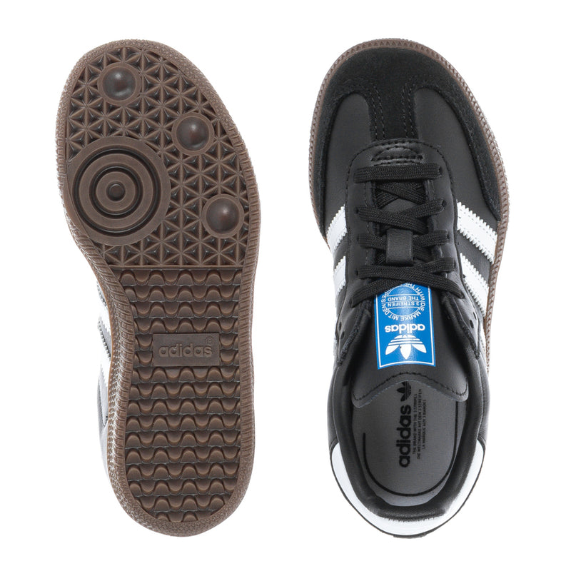 Kids retro sneaker outsoles, brown tread with adidas logo on heel and forefoot.
