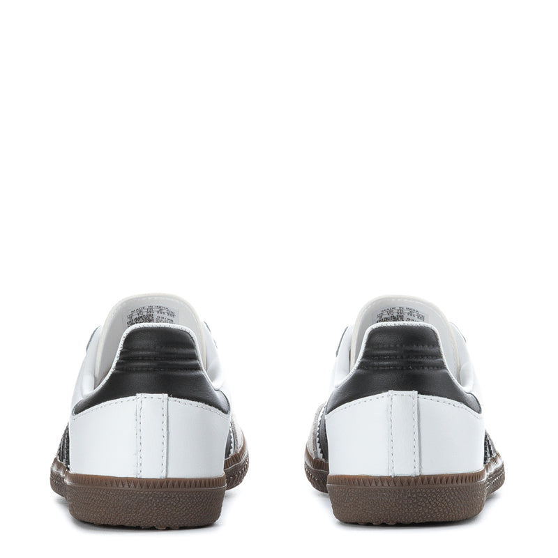 Kids' sneaker heel view with white upper, black collar trim, and gum-brown sole