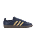 Navy men's low-top sneakers with three gold stripe overlays and gum-colored sole