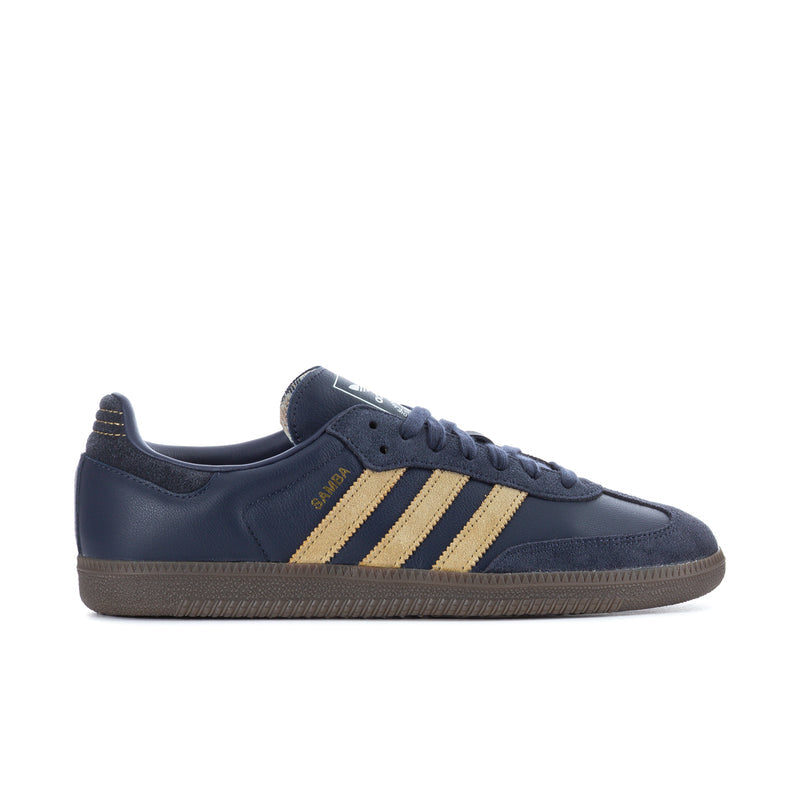 Navy men's low-top sneakers with three gold stripe overlays and gum-colored sole