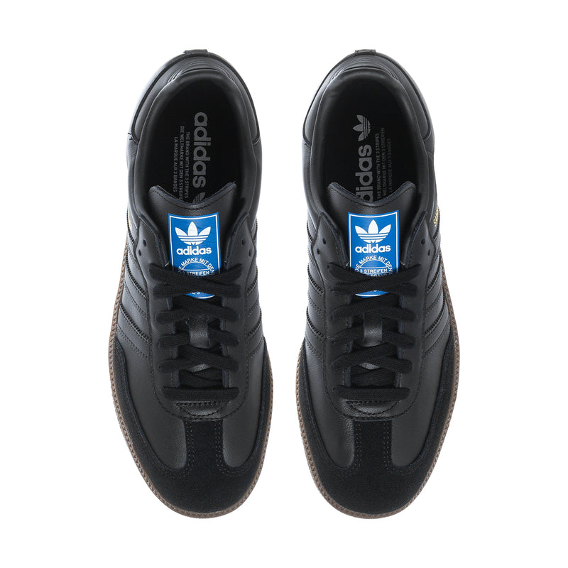 Black adidas Samba OG sneakers front view with adidas tongue branding and laces