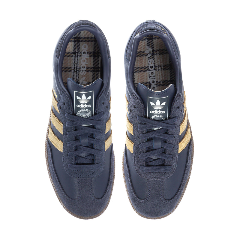 Navy men's lace-up sneakers with adidas trefoil on tongue and plaid interior lining