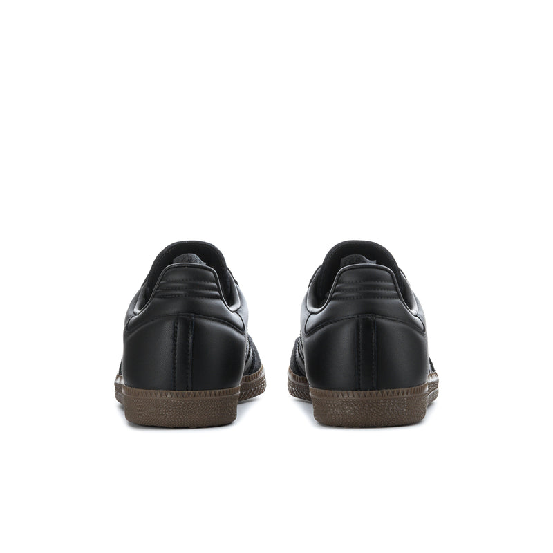 Black adidas Samba OG sneakers with gum-brown rubber outsole, back view