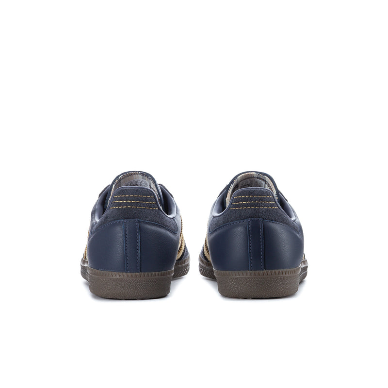 Navy men's sneakers rear view with stitched heel and gum-colored outsole
