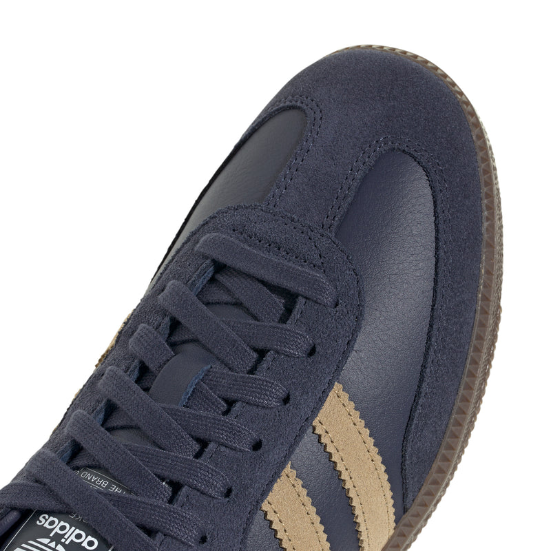 Navy lace-up sneaker upper with front panel seams and gold side stripes