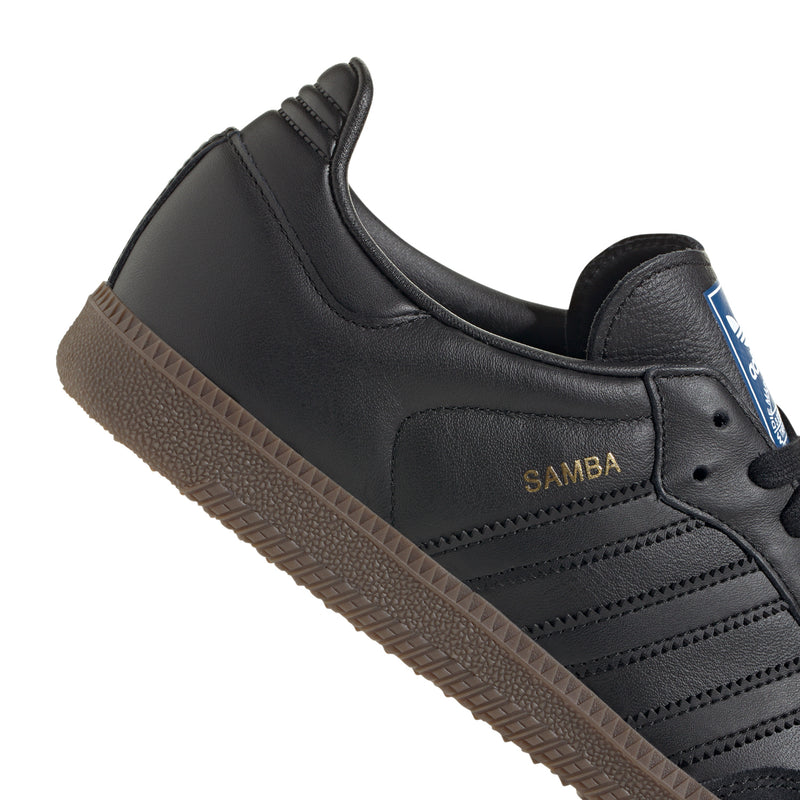 Black adidas Samba OG sneaker with embossed "Samba" logo and gum outsole