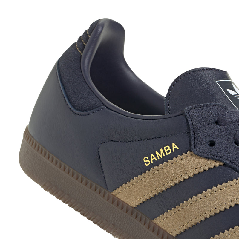 Navy sneaker collar with 'SAMBA' text, gold stripes, and gum sole edge