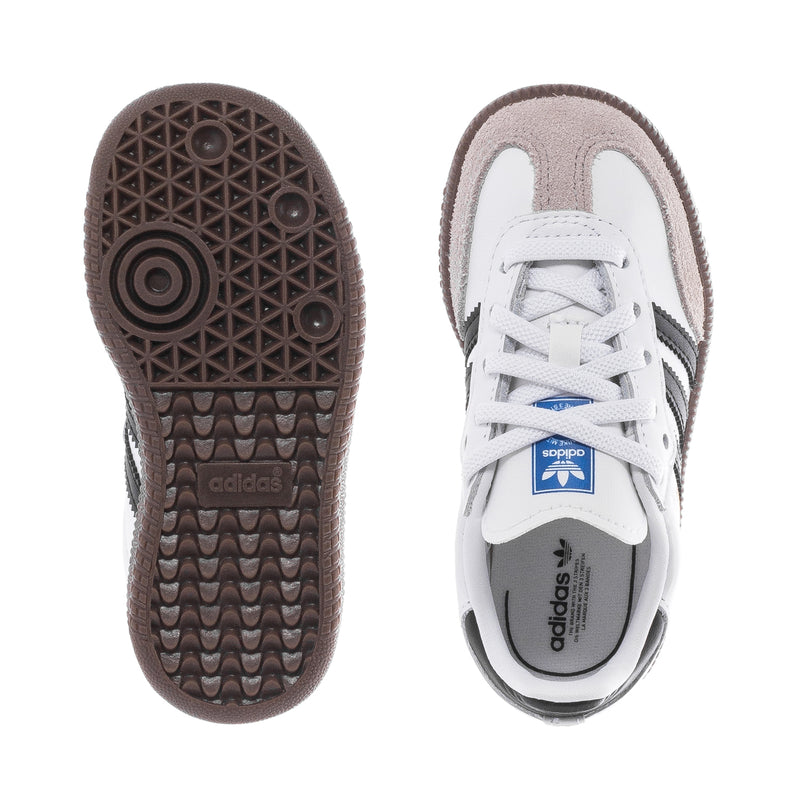 Toddler sneakers showing rubber outsole tread and adidas-printed heel collar.
