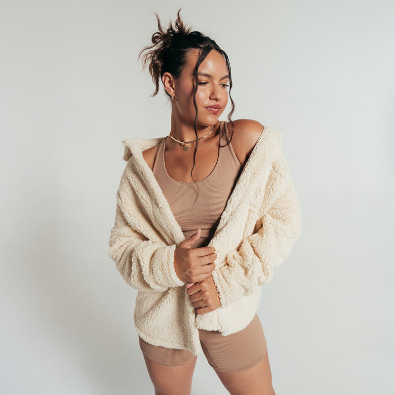 Women’s off-white sherpa hooded shirt jacket with button front and textured fleece