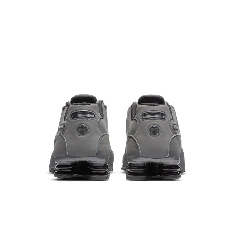 Men's dark gray lace-up sneakers, heel view, with Shox branding and cushioning pods