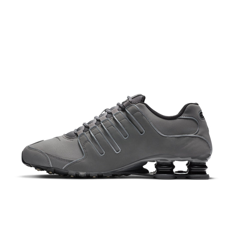 Men's dark gray lace-up sneakers with Nike swoosh and Shox heel cushioning
