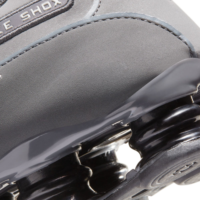 Men's dark gray Shox midsole with glossy cushioning pods and stitched upper edge
