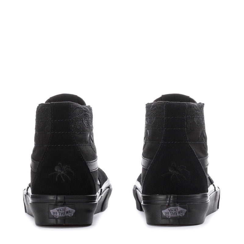 Black women's high-top sneakers with heel tabs and Vans-branded rubber cupsole