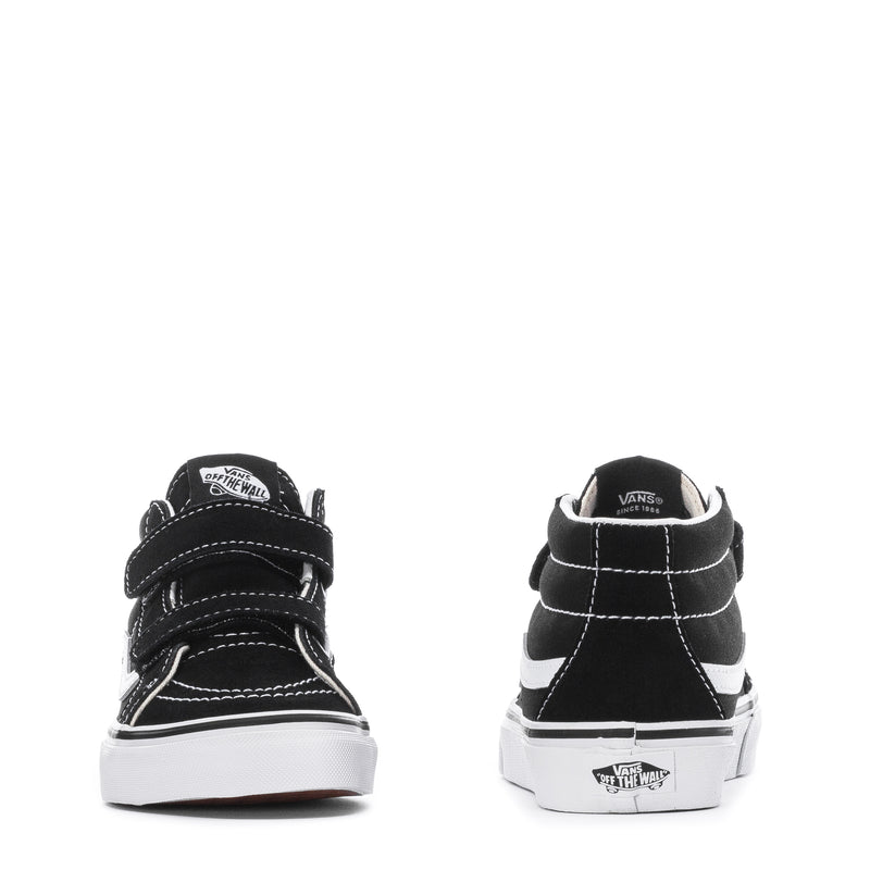 Kids' black mid-top sneakers back view with white stripe and cushioned heel collar