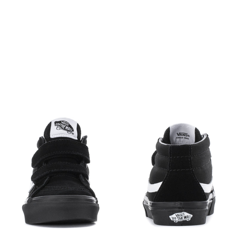 Kids' black mid-top skate shoes, rear view with heel logo and white side stripe