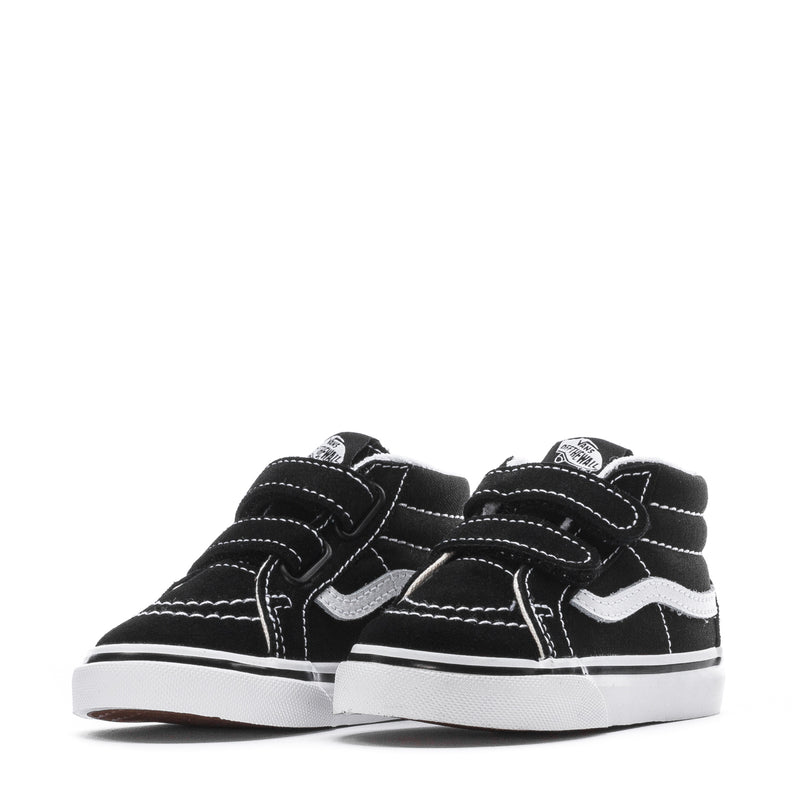 Pair of black toddler mid-top sneakers with white wavy side stripe and hook-and-loop straps