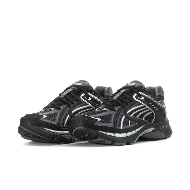 Women's black running shoes with silver accents, lace-up front and cushioned sole