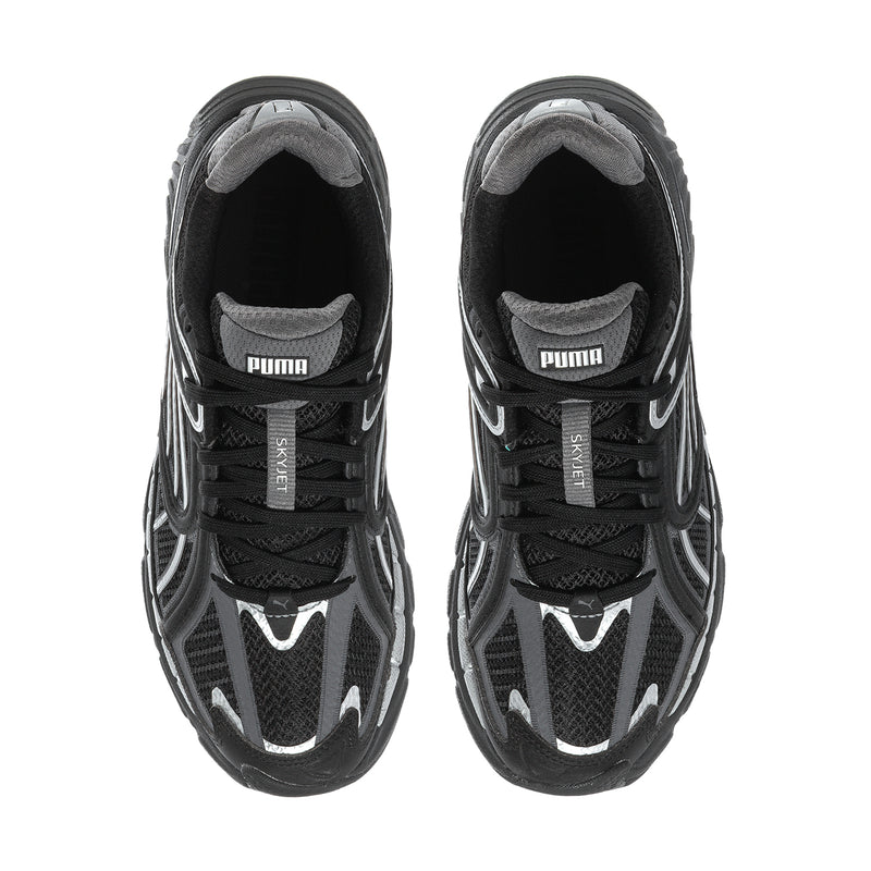 Women's black running shoes with PUMA label at tongue and lace-up upper