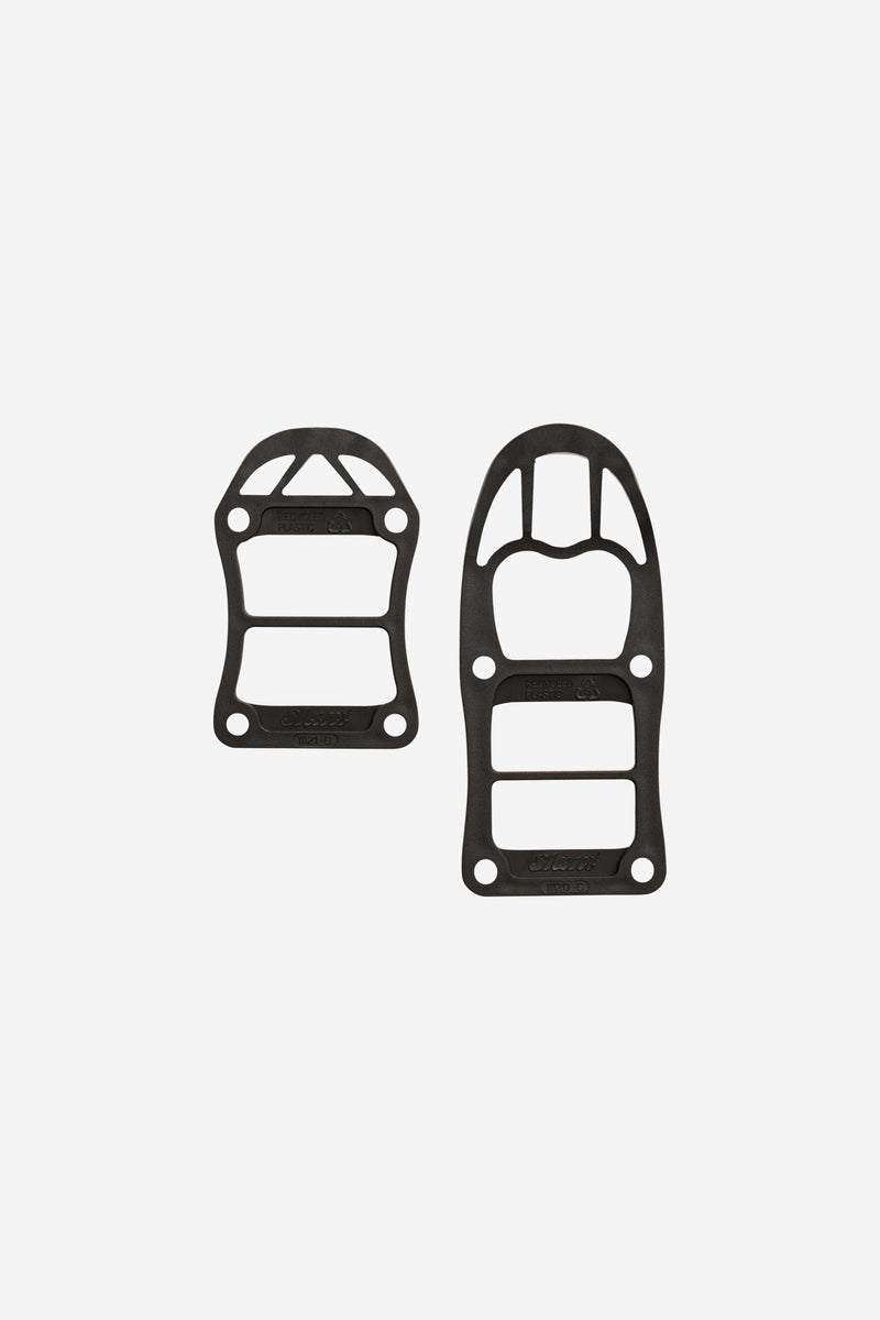 Two black Slant Ss Stackable Riser Pads for skateboards with interlocking design for extra wheel clearance