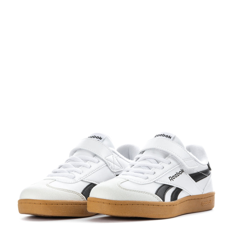 Kids white low-top sneakers with black stripes, lace-up, and gum midsoles