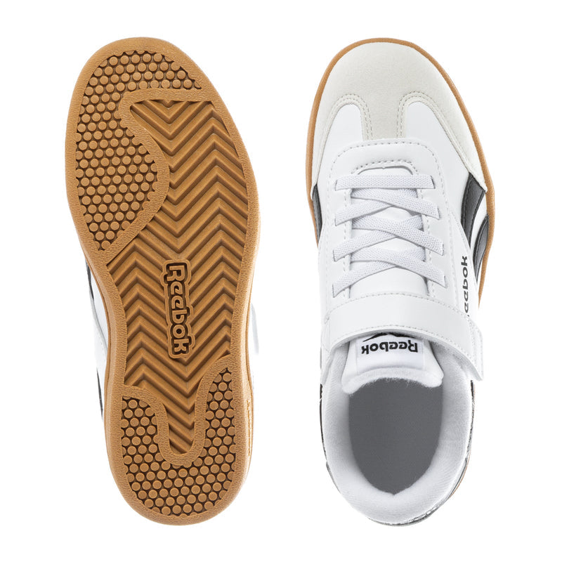 Kids sneaker outsole and heel with textured gum tread and white upper