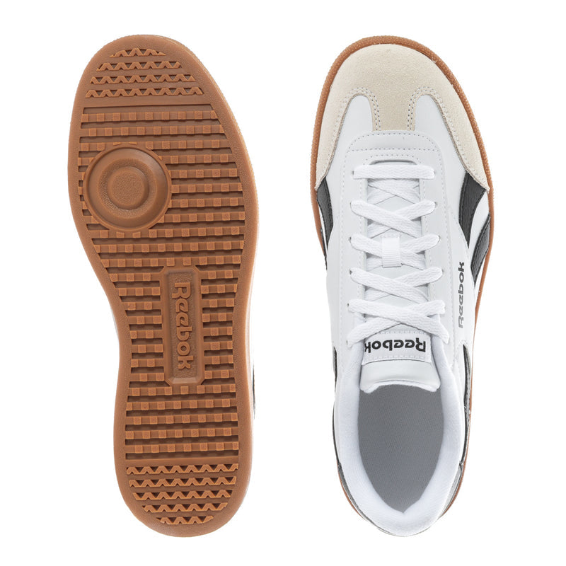 White sneaker outsole and side view with lace-up design and gum rubber tread