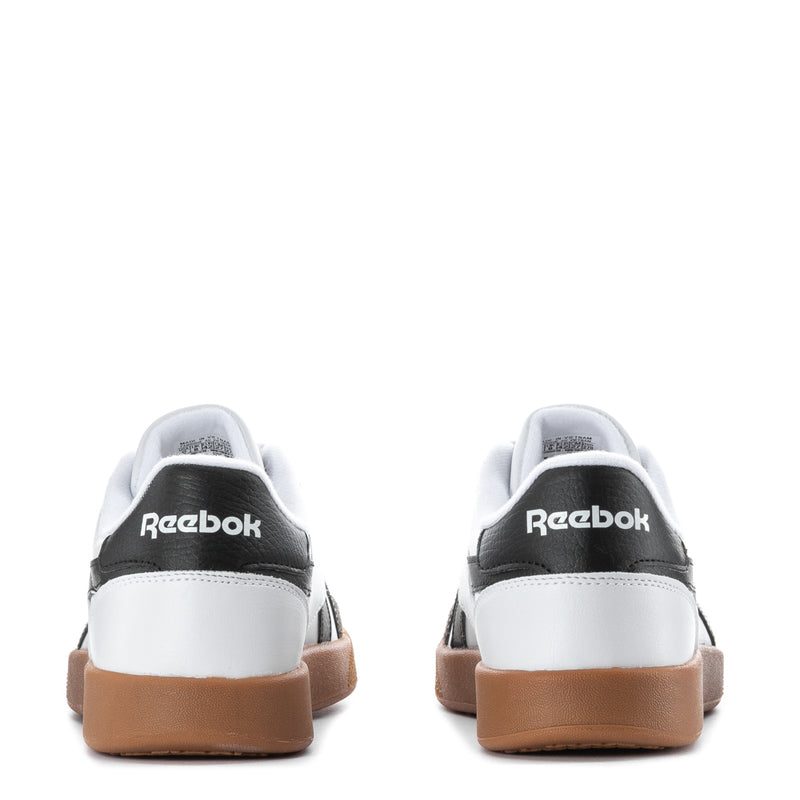 Mens white sneakers heel view with Reebok logo and gum heel tab