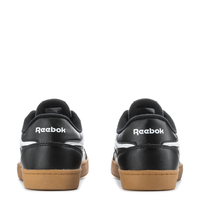 Youth sneakers back view, black upper, white logo, gum sole, lace-up