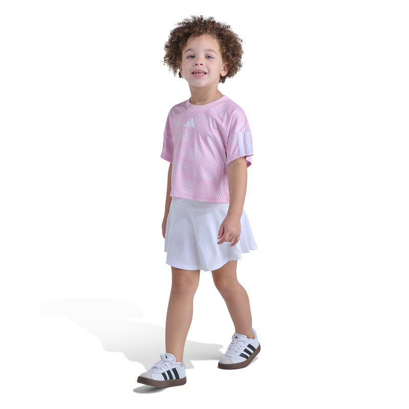 Kids pink striped soccer jersey top with white skort skirt, front view