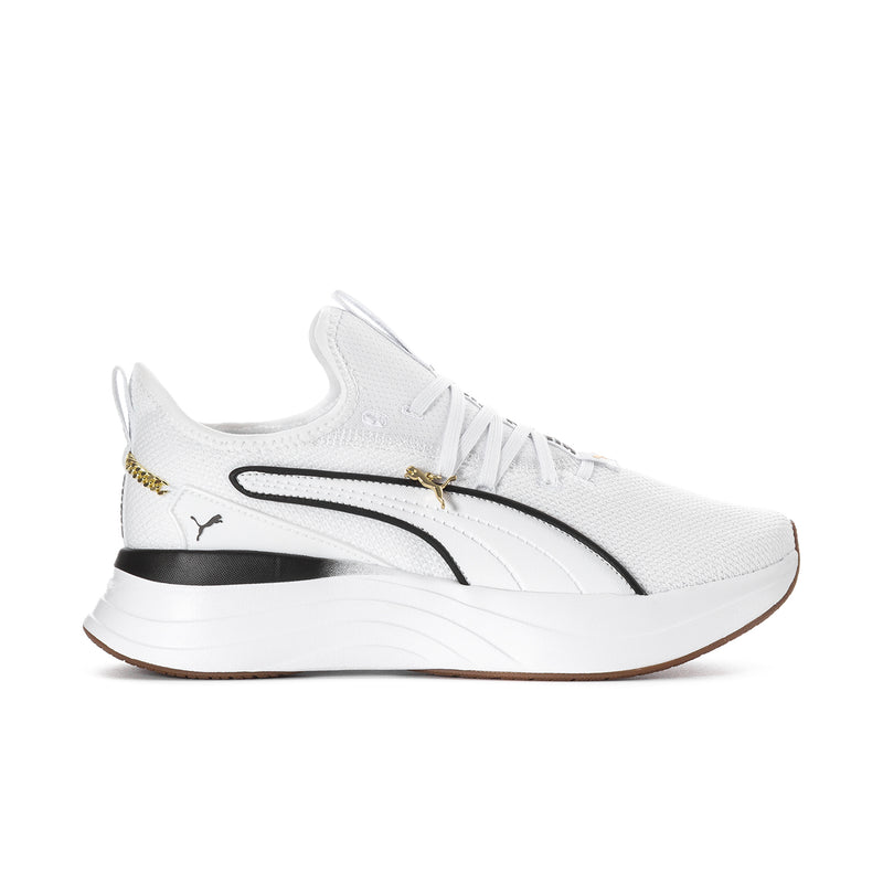White low-top lace-up sneaker with black stripe and gold accent on chunky sole.