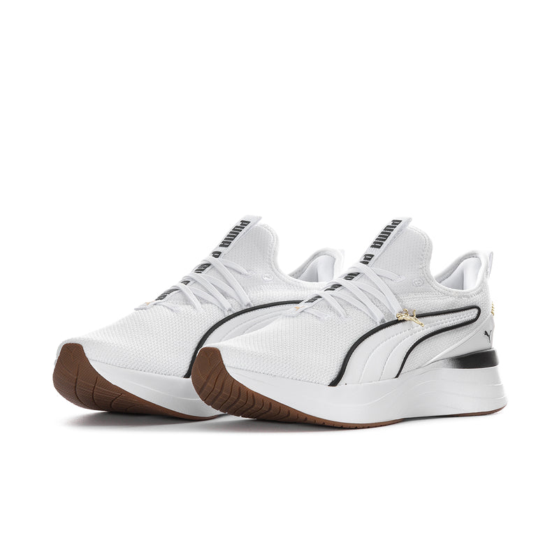 White lace-up sneaker with black PUMA stripe, gold lace detail, and brown outsole.