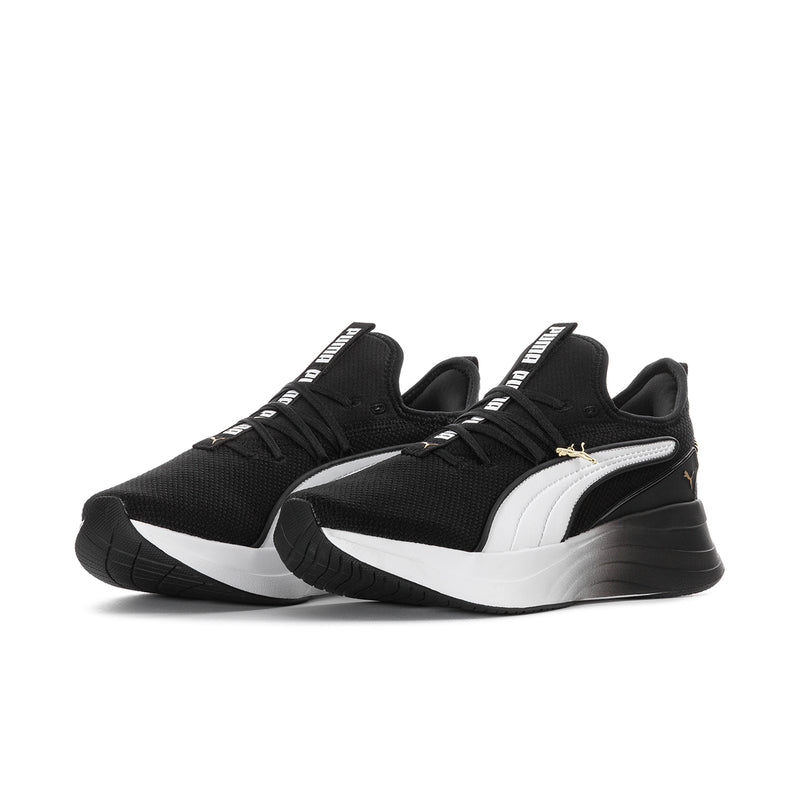Black and white women's sneakers with white PUMA formstripe and thick sole