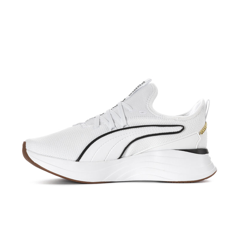White low-top sneaker profile with black stripe, gold accents, and cushioned midsole.