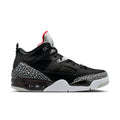 Black low-top sneakers with elephant-print side panel, red heel accent, and white midsole