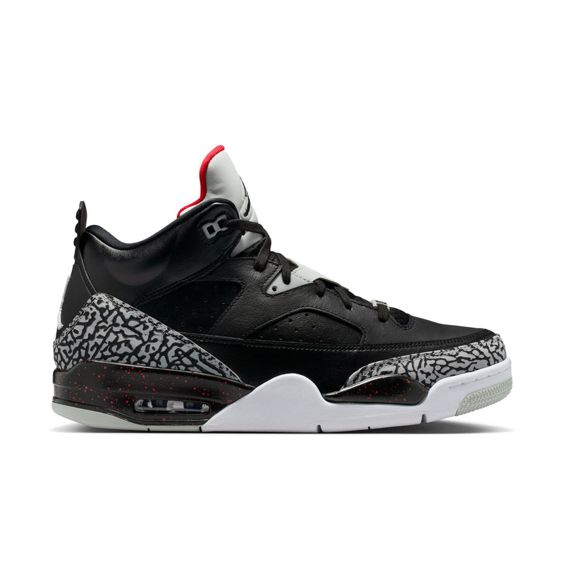 Black low-top sneakers with elephant-print side panel, red heel accent, and white midsole