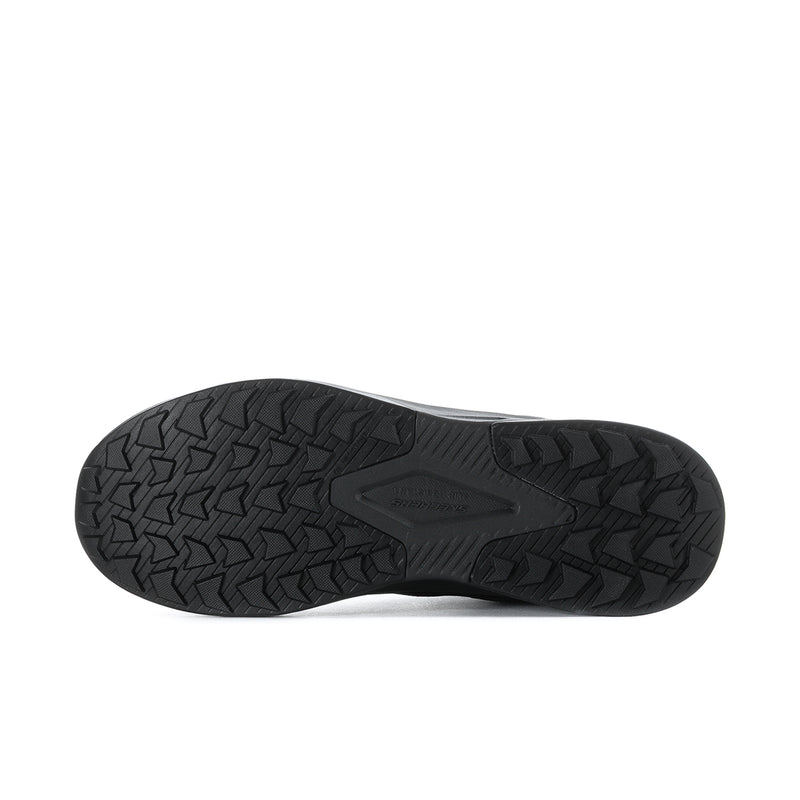Men's black composite-toe hiking boot outsole with deep herringbone tread pattern.