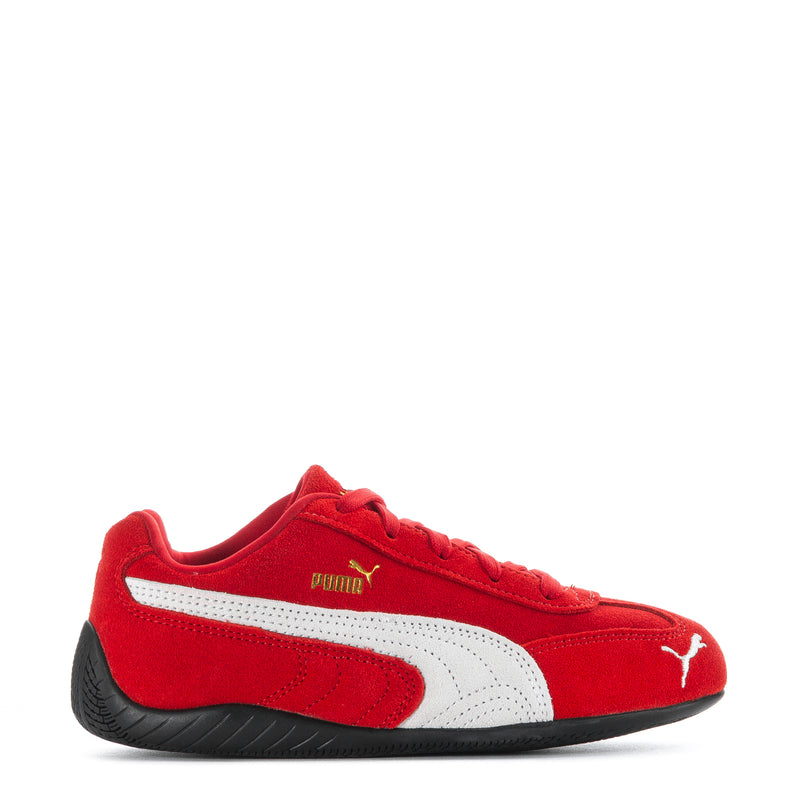 Kids red suede sneakers with white Puma stripes and black outsole