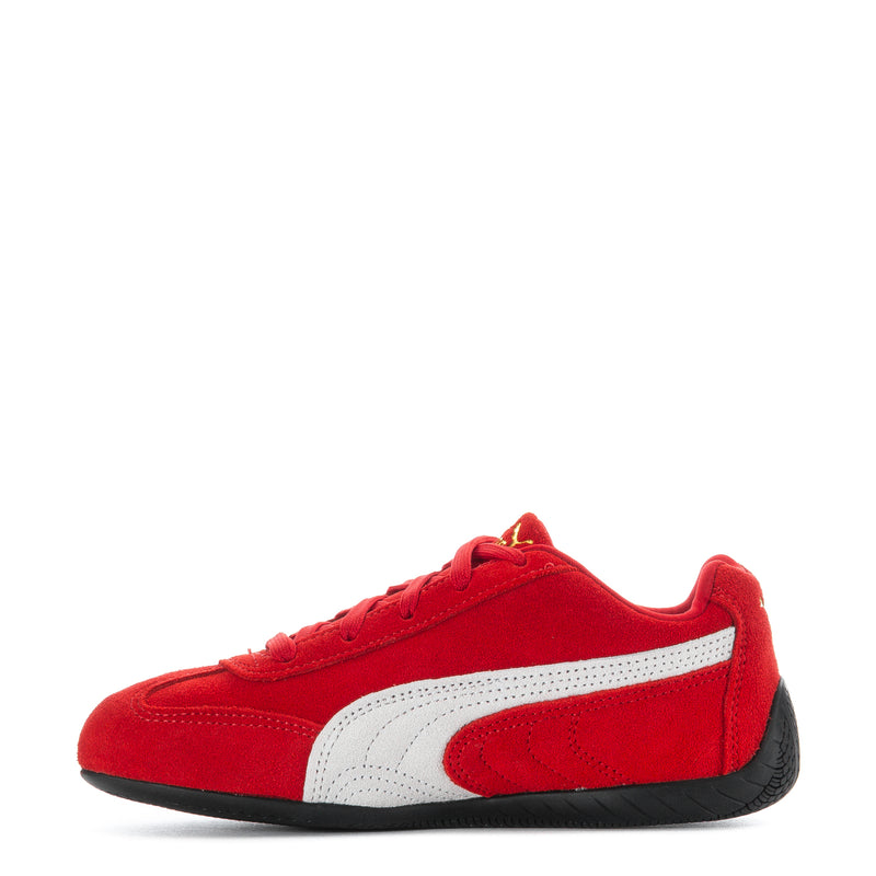 Kids red low-top sneakers with white side stripe and black sole