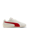 Women's Puma sneaker in off-white with red Puma logo and side stripe