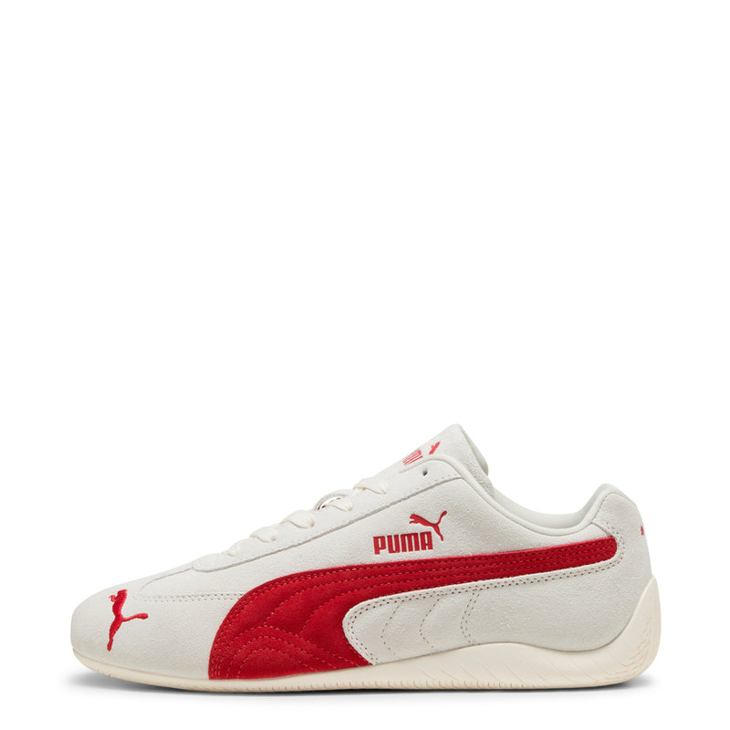 Women's Puma sneaker front side view; off-white upper with red stripe and cat logo