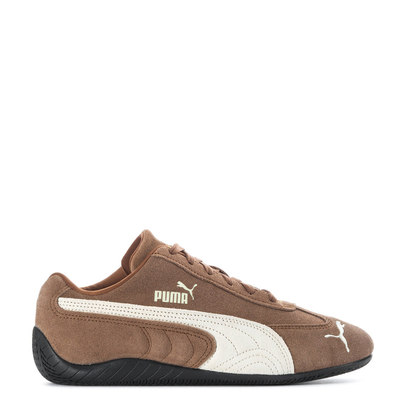 Youth low-top sneakers in brown suede with white Puma logo and black rubber sole.