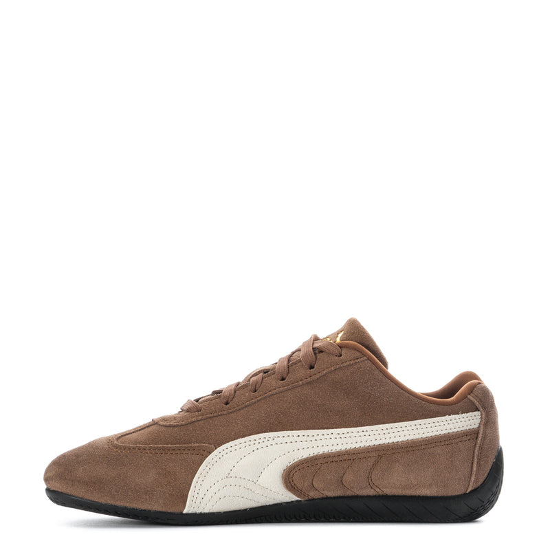 Youth low-top sneakers, side view, brown suede with white mid panel and lace-up.