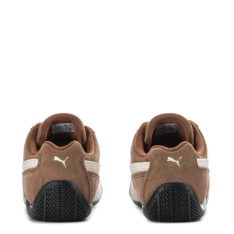 Youth sneakers heel view, brown suede with white heel stripe and black traction outsole.