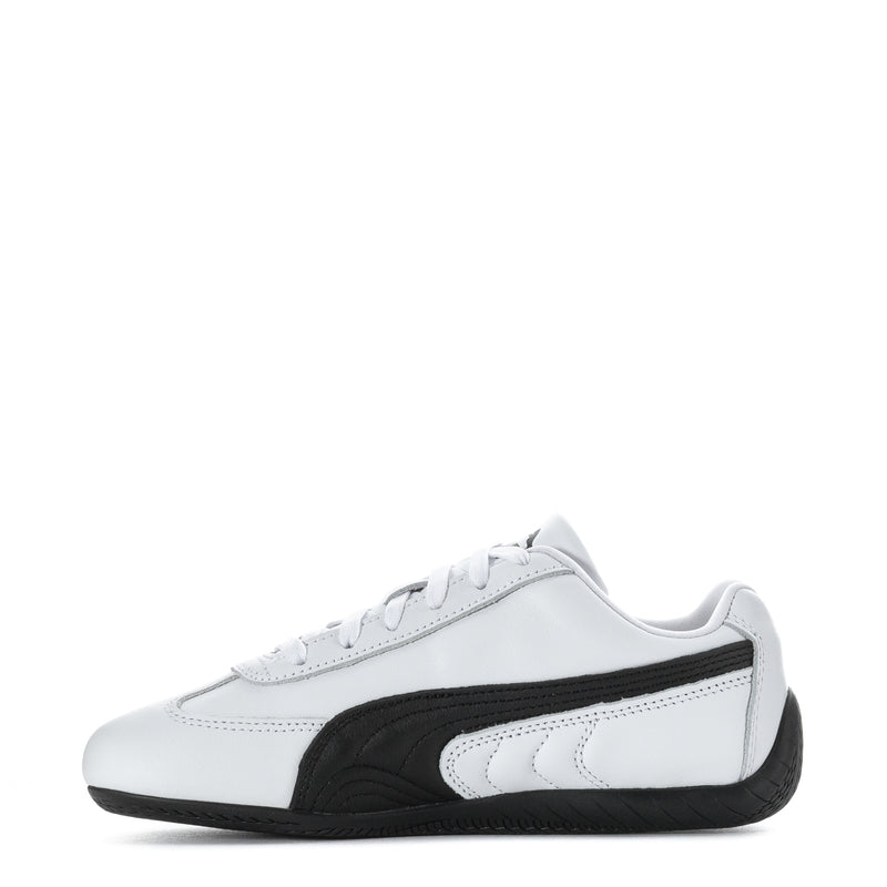 White and black women's leather sneakers, side view with black stripe detail